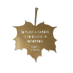Hanging metal leaf with quote by Audrey Hepburn