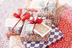 Pile of presents in Cambridge Imprint paper