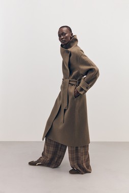 Tu-AW26-Model-06 -Khaki Wool-Blend Double-Faced Coat £85, Brown Heritage Check Trousers £22.50, Khaki Low-Profile Trainer £20