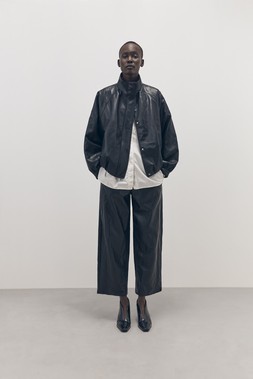 Tu-AW26-Model-25 - Black PU Batwing Funnel-Neck Bomber Jacket £40 White Poplin Relaxed Shirt £20 Black PU Pull-On Barrel Trousers £24 Black Shoe Boot £25
