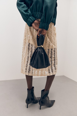 Tu-AW26-Model-57 - Bomber Jacket £35, Midi Skirt £36, Gold Hardware Wrist-Knot Bag £12, Ankle Boot £28 