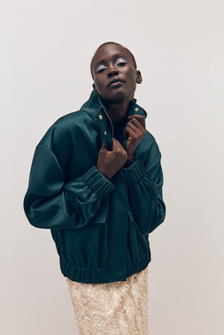 Tu-AW26-Model-58 - Teal Heavy Satin Bomber Jacket £35, Neutral Sequin Tassel Midi Skirt £36 